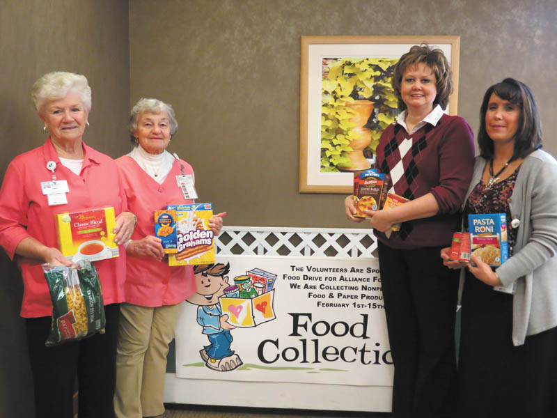 SPECIAL TO THE VINDICATOR
In recognition of Heart Month, the Alliance Community Hospital volunteers are asking for donations of nonperishable foods and paper products for its Have a Heart food drive through Feb. 15. Items will be given to the Alliance Community Food Pantry and can be placed in a box in the hospital cafe. Holding some of the items that have been collected are, from left, Barb Morgan and Eleanor Carver, ACH volunteers; Michele Quinn, coordinator of volunteer services; and Wendy Tabellion. Volunteers range in age from 16 to 93. Last year the food pantry gave away 931,000 pounds of food, an increase of 37 percent since 2012. For information about the drive call the volunteer department at 330-596-7821 or 330-596-7822. For information about ACH visit www.achosp.org or the hospital’s Facebook page. 