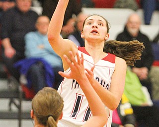 Fitch’s Megan Sefcik (11) shoots over Lakeview’s Alli Pavlik (15) during Monday’s game in Austintown. The
Falcons cruised to a 53-26 victory.