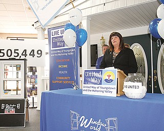 Becky Wall, chairwoman of the United Way of Youngstown and the Mahoning Valley’s 2013 campaign, speaks Wednesday at UW’s 2013 campaign results meeting at Window World in Boardman. Wall is vice president of Dearing Compressor and Pump Co.