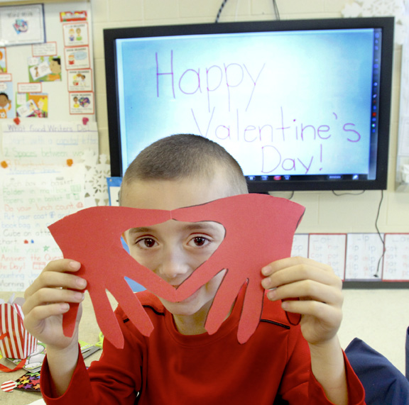 William d Lewis The Vindicator  Austintown Elem School kindergarten student Nicholas Beatty shows off a Valentines craft project he made during a Valentines party 2-13 at his school.