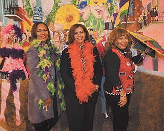 THE VINDICATOR | Katie Rickman
Part of the Junior Civic League of Youngstown’s mission is to promote education, and for the third year it’s organizing a Mardi Gras party to raise funds for scholarships. Some of the JCL members on the committee are, from left, Veronica Crafter-Srinivasan, chairwoman; Susan M. Moorer, president; and Yvette Clark-Kirksey, co-chairwoman.