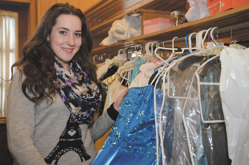 Katie Rickman | The Vindicator. Katie Rickman | The Vindicator
Megan Factor, a senior at Canfield High School and a member of the National Honor Society, looks through dresses donated to benefit Diva Donations.