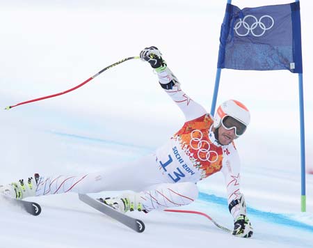 The United States’ Bode Miller passes a gate Sunday in the men’s super-G at the Winter Olympics in Krasnaya Polyana, Russia.