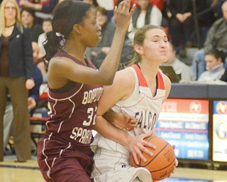Boardman’s Jada Redd closely guards Fitch’s Megan Sefcik during their Division I sectional basketball game Monday at Fitch High School in Austintown. Sefcik and teammate Cassie Custer each scored 19 points for the Falcons, who pulled past the Spartans, 65-62.
