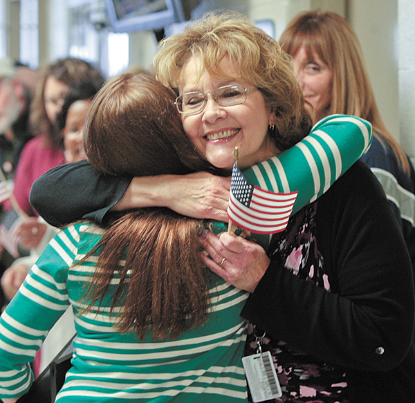 Harrell gets a hug from Marcia Bodine as she entered the private prison.