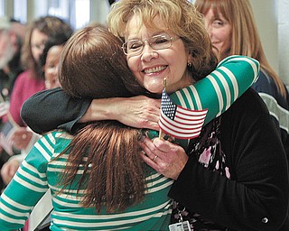 Harrell gets a hug from Marcia Bodine as she entered the private prison.