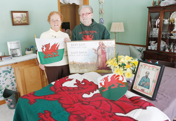 Images of St. David, daffodils and the Welsh flag and shield will be on display at the St. David’s Day banquet being planned by Rhea Crelin, left, coordinator, and John Tamplin, president of the St. David’s Society of Youngstown. The banquet March 1 celebrates Welsh heritage and the patron saint of Wales.