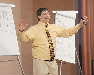 Art Benjamin, a “mathemagician,” performs magic with math for students Wednesday in the Chestnut Room of Youngstown State University’s Kilcawley Center.