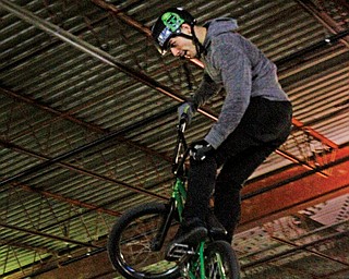 Nick Bruce goes airborne and makes a twirl as he tops a ramp.