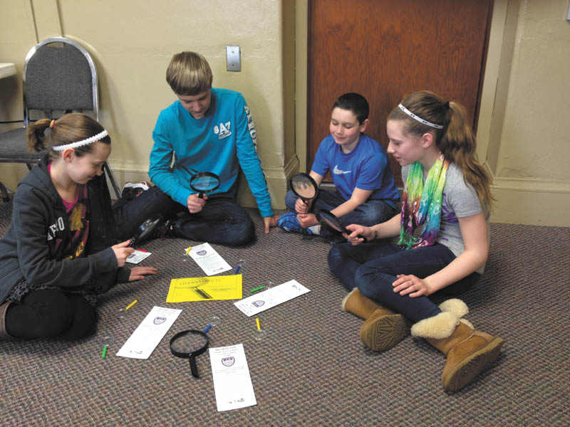 SPECIAL TO THE VINDICATOR
Investigation Day will take place from 8:45 a.m. to 1:30 p.m. Thursday at Heartland Christian School, 28 Pittsburgh St., Columbiana. Students practicing investigation are, from left to right, Rebekah Bell, Jordan Stackpole, Jackson Bussard and Hannah Brandenstein. Prospective families are welcome to visit and should call 330-482-2331 or email lbrandenstein@heartlandschool.org for reservations.