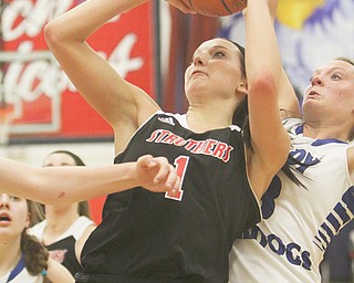 Ashleigh Ryan of Struthers puts in a layup against Lakeview defender Abby Pavlik during the second half of their Division II district semifinal on Monday at Fitch High School in Austintown. Ryan recorded a game-high 19 points with nine rebounds to help lead the Wildcats over the Bulldogs, 53-39. Struthers faces the winner of tonight’s West Branch-Ravenna contest in the district title game Friday.