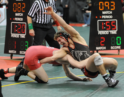 Nick Cardiero of Giard makes a move to take the back of Jared Pack of Centerburg during their 170lb Division 3 championship bracket bout during the State High School Wrestling meet on February 27, 2014 at Jerome Schottenstein Center in Columbus, Ohio.