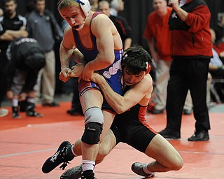 Korey Frost of Canfield attempts to drag down Mike Stewart of Marengo Highland down to the mat during their 120lb Division 2 championship bracket bout during the State High School Wrestling meet on February 27, 2014 at Jerome Schottenstein Center in Columbus, Ohio.