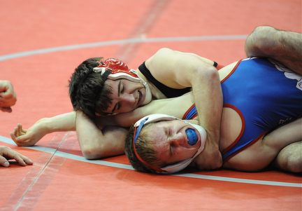 Korey Frost of Canfield scores points with a near fall of Mike Stewart of Marengo Highland during their 120lb Division 2 championship bracket bout during the State High School Wrestling meet on February 27, 2014 at Jerome Schottenstein Center in Columbus, Ohio.