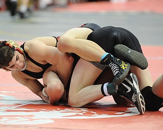 Georgio Poullas of Canfield works to control the arm of Luke Leonard of Fostoria during their 126lb Division 2 championship bracket bout during the State High School Wrestling meet on February 27, 2014 at Jerome Schottenstein Center in Columbus, Ohio.