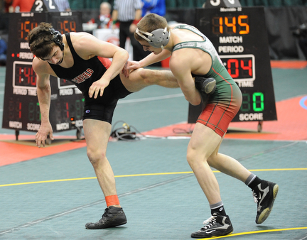 C.J. Frost of Canfield attempts to avoid being tripped by Josh Mossing of Toledo Central Catholic during their 138lb Division 2 championship bracket bout during the State High School Wrestling meet on February 27, 2014 at Jerome Schottenstein Center in Columbus, Ohio.