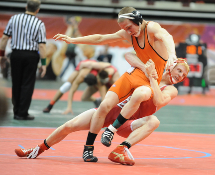 Daniel Hasson of Beaver Local takes down Preston Bowshier of Springfield Kenton Ridge during their 138lb Division 2 championship bracket bout during the State High School Wrestling meet on February 27, 2014 at Jerome Schottenstein Center in Columbus, Ohio.
