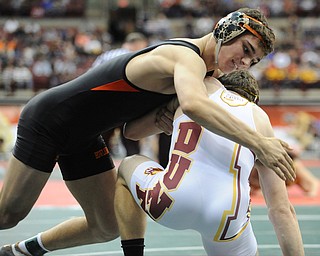 David-Brian Whister of Howland attempts to work to the back of Andrew Dunn of Hamilton Ross during their 152lb Division 2 championship bracket bout during the State High School Wrestling meet on February 27, 2014 at Jerome Schottenstein Center in Columbus, Ohio.
