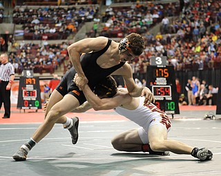 David-Brian Whister of Howland slips out of a takedown attempt from Andrew Dunn of Hamilton Ross during their 152lb Division 2 championship bracket bout during the State High School Wrestling meet on February 27, 2014 at Jerome Schottenstein Center in Columbus, Ohio.