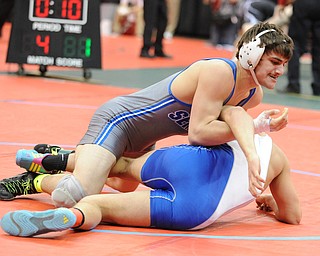 Mike Audi of Poland rolls over Tye Smith of Washington Court House to go for a pin during their 170lb Division 2 championship bracket bout during the State High School Wrestling meet on February 27, 2014 at Jerome Schottenstein Center in Columbus, Ohio.