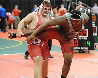 Cody Martsolf of Beaver Local attempts to go for the trip of Jquan Fisher of Toledo Central Catholic during their 285lb Division 2 championship bracket bout during the State High School Wrestling meet on February 27, 2014 at Jerome Schottenstein Center in Columbus, Ohio.