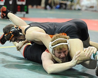 COLUMBUS, OHIO - FEBRUARY 28, 2014: David-Brian Whisler of Howland and Reyse Wallbrown of Indian Valley wrestle on the mat during their 152lb consolation bracket bout during the 2014 division 2 state wrestling tournament at Schottenstein Center.