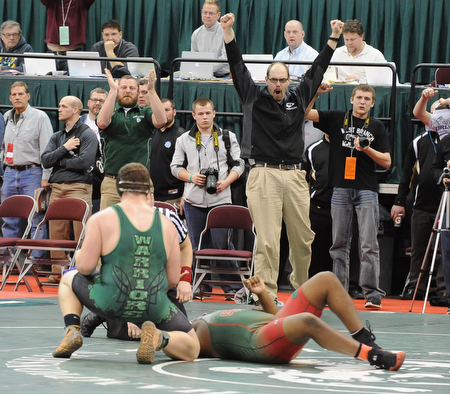 COLUMBUS, OHIO - FEBRUARY 28, 2014: The West Branch coaching staff celebrates after a pin by Logan Sharp over Jquan Fisher of Toledo Central Catholic during their 285lb championship bracket bout during the 2014 division 2 state wrestling tournament at Schottenstein Center...I could not get ID's of the coaches. I could not find them in the arena, and no one knew what their names were.