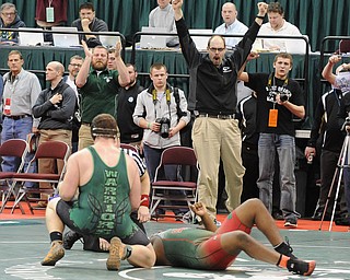 COLUMBUS, OHIO - FEBRUARY 28, 2014: The West Branch coaching staff celebrates after a pin by Logan Sharp over Jquan Fisher of Toledo Central Catholic during their 285lb championship bracket bout during the 2014 division 2 state wrestling tournament at Schottenstein Center...I could not get ID's of the coaches. I could not find them in the arena, and no one knew what their names were.