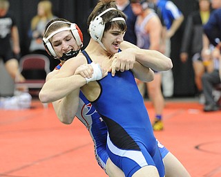 COLUMBUS, OHIO - FEBRUARY 28, 2014: Mike Audi of Poland attempts to free himself from the grasp of Zeck Lehman of Revere during their 170lb consolation bracket bout during the 2014 division 2 state wrestling tournament at Schottenstein Center.