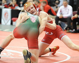 COLUMBUS, OHIO -FEBRUARY 28, 2014:Daniel Hasson of Beaver Local controls Josh Mossing of Toledo Central Catholic as the two grapple on the mat during their 138lb championship bracket bout during the 2014 division 2 state wrestling tournament at Schottenstein Center.