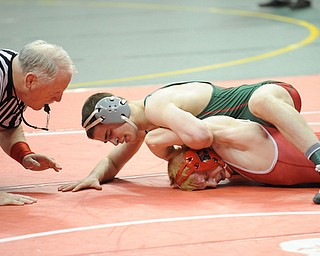 COLUMBUS, OHIO -FEBRUARY 28, 2014: Josh Mossing of Toledo Central Catholic  rides the back of Daniel Hasson of Beaver Local during their 138lb championship bracket bout during the 2014 division 2 state wrestling tournament at Schottenstein Center.