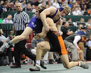 COLUMBUS, OHIO -FEBRUARY 28, 2014: David-Brian Whisler of Howland picks up Mike Repko of Vermilion before taking him to the mat during their 152lb championship bracket bout during the 2014 division 2 state wrestling tournament at Schottenstein Center.