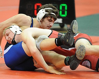 COLUMBUS, OHIO -FEBRUARY 28, 2014: Mike Audi of Poland attempts to work off his back while being rolled over by Aaron Schuette of Wauseon during their 170lb championship bracket bout during the 2014 division 2 state wrestling tournament at Schottenstein Center.