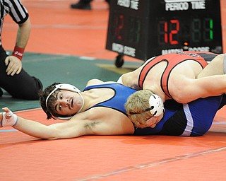 COLUMBUS, OHIO -FEBRUARY 28, 2014: Mike Audi of Poland attempts to get out from under Aaron Schuette of Wauseon during their 170lb championship bracket bout during the 2014 division 2 state wrestling tournament at Schottenstein Center.