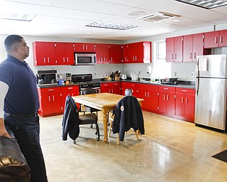        ROBERT K. YOSAY  | THE VINDICATOR..Captain Perry Harrison in the new dining room area ..YFD newest station on Midlothian- has two bays - living area - dorm area - bathrooms with showers - ..The new station is in the 1600 block of East Midlothian. It is 4,800 square feet and cost just under $1 million to build..It replaces a station from the 1930s at Midlothian and Sheridan that needed major repairs.
