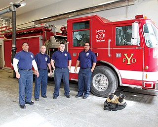 Members of the Youngstown Fire Department are happy about the new Station No. 9 on East Midlothian Boulevard on the city’s South Side. At the top, from left, are Capt. Perry Harrison, William Palma, Jeff Goodlet and Lt. Chris Brown.