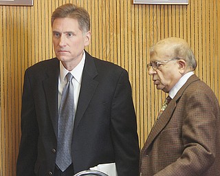 Randy J. Dunn, outgoing Youngstown State University president, and Dr. Sudershan Garg, chairman of the
YSU trustees, head into an executive session Wednesday where an amendment to Dunn’s contract will allow him
to leave YSU on March 21.