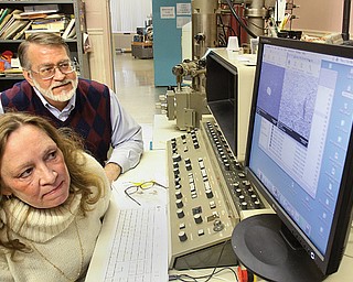 Carol and Andrew Hirt examine results at Materials Research Laboratories Inc., a state-of-the-art facility in Struthers that provides materials-analysis services to industries both domestic and abroad. The two own MRL, which has been located in the former Holy Trinity School since 1993.