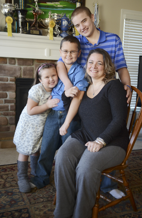 Katie Rickman | The Vindicator.Christie Terlesky poses with her children Thursday, March 6, 2014..L-R.Emma 5, Tyler 9, Brian 14, and Christie