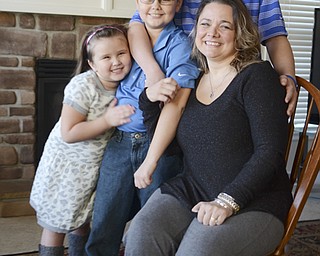 Katie Rickman | The Vindicator.Christie Terlesky poses with her children Thursday, March 6, 2014..L-R.Emma 5, Tyler 9, Brian 14, and Christie