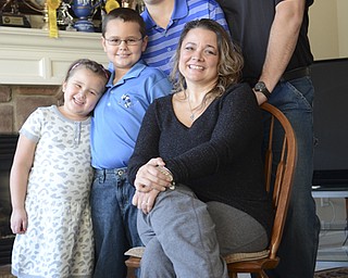 Katie Rickman | The Vindicator.The Terlesky family poses in their Boardman home Thursday, March 6, 2014...Standing L-R .Emma 5, Tyler 9, Brian Jr. 14, and Brian Sr..Seated: Christie Terlesky