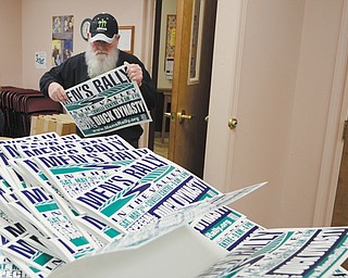 Bob Bartholow of Leetonia stacks signs to be assembled for Men’s Rally in the Valley Thursday, March 6, 2014 at Faith Chapel in Salem.