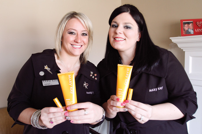 Mary Kay Rep Crystal Rycek and Kayti Patterson with the lip balm and sun protector they want to sell for OPERATION SUNSCREEN for active military overseas