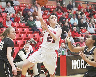 Youngstown State’s Liz Hornberger puts up a shot against Oakland’s Victoria Lipscomb during the first half of Wednesday’s Horizon League quarterfinal at YSU’s Beeghly Center. The Penguins downed the Golden Grizzlies, 68-64. Hornberger made three 3-pointers to tie Dianne Rappach (1988-92) for the school’s career record of 198.