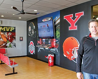 Rick Camardo, above, wanted to bring the franchise to Youngstown. The Boardman SportClips recently opened to provide a sports-themed environment for customers.