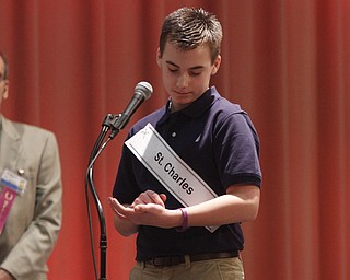  .          ROBERT  K. YOSAY | THE VINDICATOR.. SaturdayÕs 81st Vindicator Regional Spelling Bee..Faces  St Charles  Alex Stoneman  spells on his hand and arm.-30-
