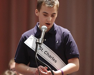  .          ROBERT  K. YOSAY | THE VINDICATOR.. SaturdayÕs 81st Vindicator Regional Spelling Bee..Faces  St Charles  Alex Stoneman  spells on his hand and arm.-30-