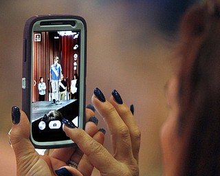  .          ROBERT  K. YOSAY | THE VINDICATOR.. SaturdayÕs 81st Vindicator Regional Spelling Bee...Gettin a memory ona smart phone is Marian Diana -  on the phone is John Michael Diana from st Rose 7th grade ..-30-