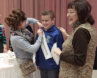  .          ROBERT  K. YOSAY | THE VINDICATOR.. SaturdayÕs 81st Vindicator Regional Spelling Bee...Getting sashed is Jackson Lambert 6th grader by his siter Brooke = looking on is principal Mrs. Cynthia R. Mulgrew .-30-