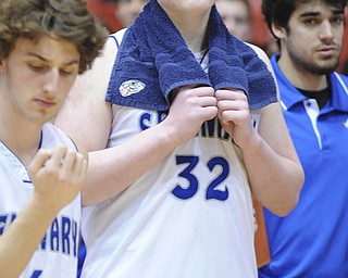 CANTON, OHIO - MARCH 15, 2014: Danny Black #32 of Poland holds back tears as he watches players from SVSM celebrate on the after the regional final game Saturday afternoon at the Canton Civic Center. Poland #4 Steven Andrews pictured.